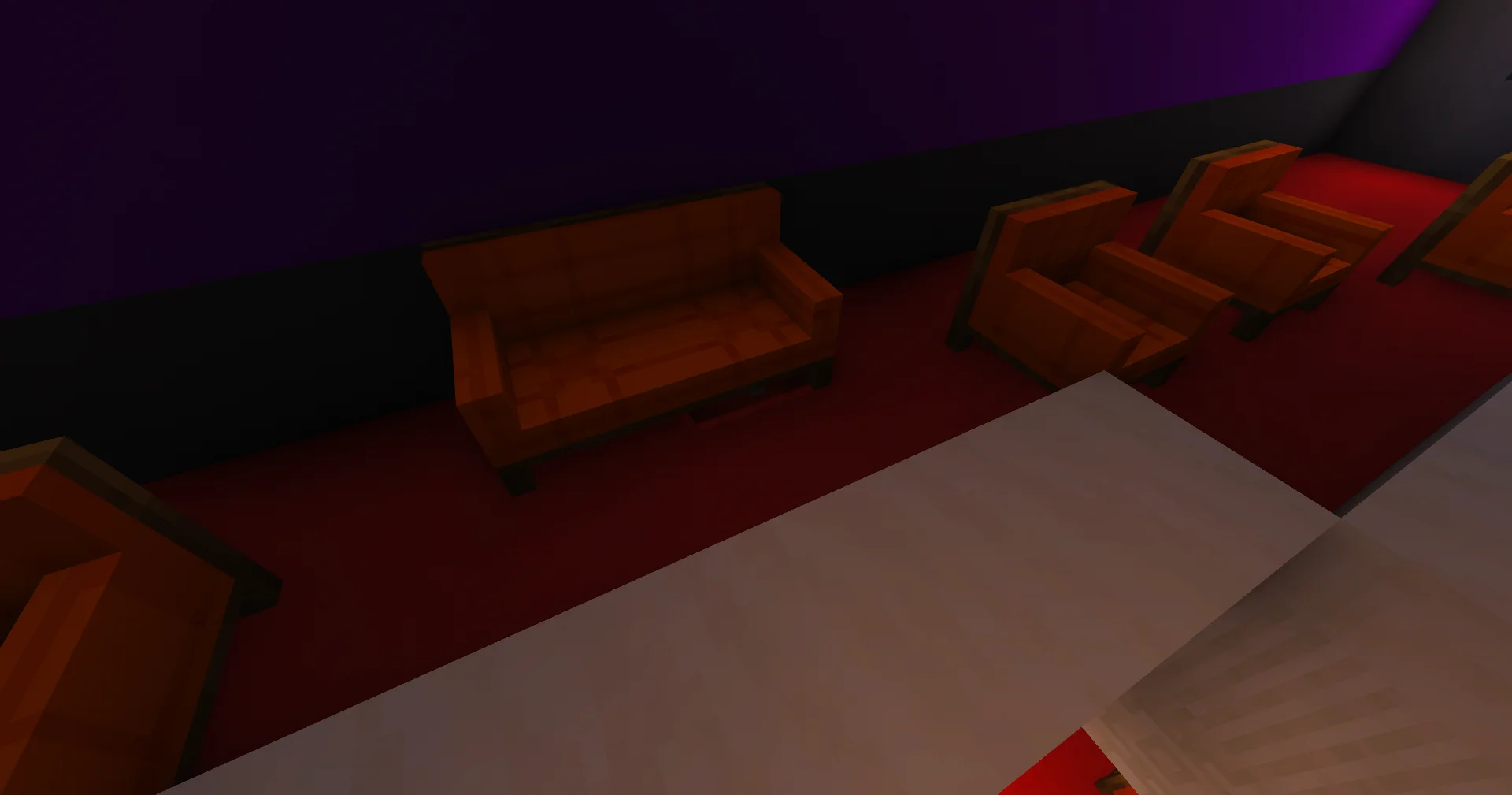 Fannie - Orange sofas concealing an upper-floor barrel